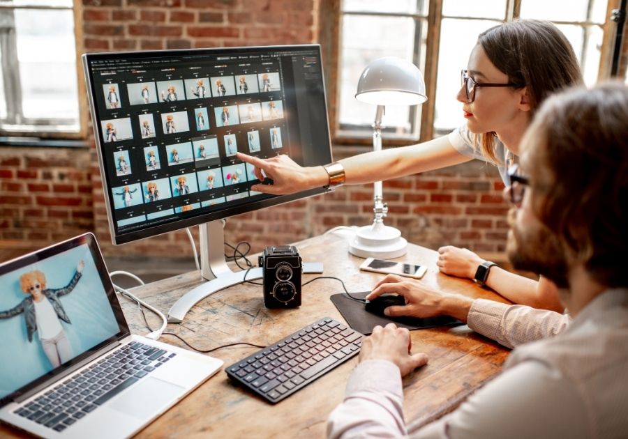 People selecting images in a computer screen.